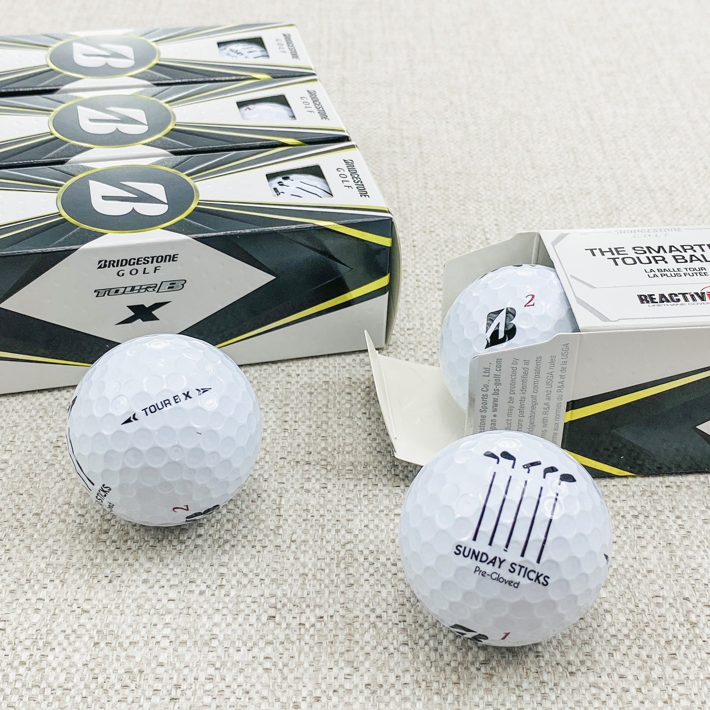 2022 Bridgestone Tour B-X (white) - 2 x dozen, brand new. Sunday Sticks logo.